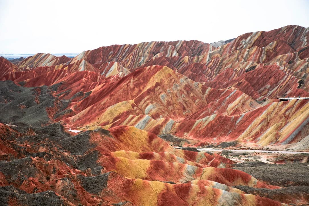 Red, ochre and pale striped hills at Zhangye Danxia in Gansu